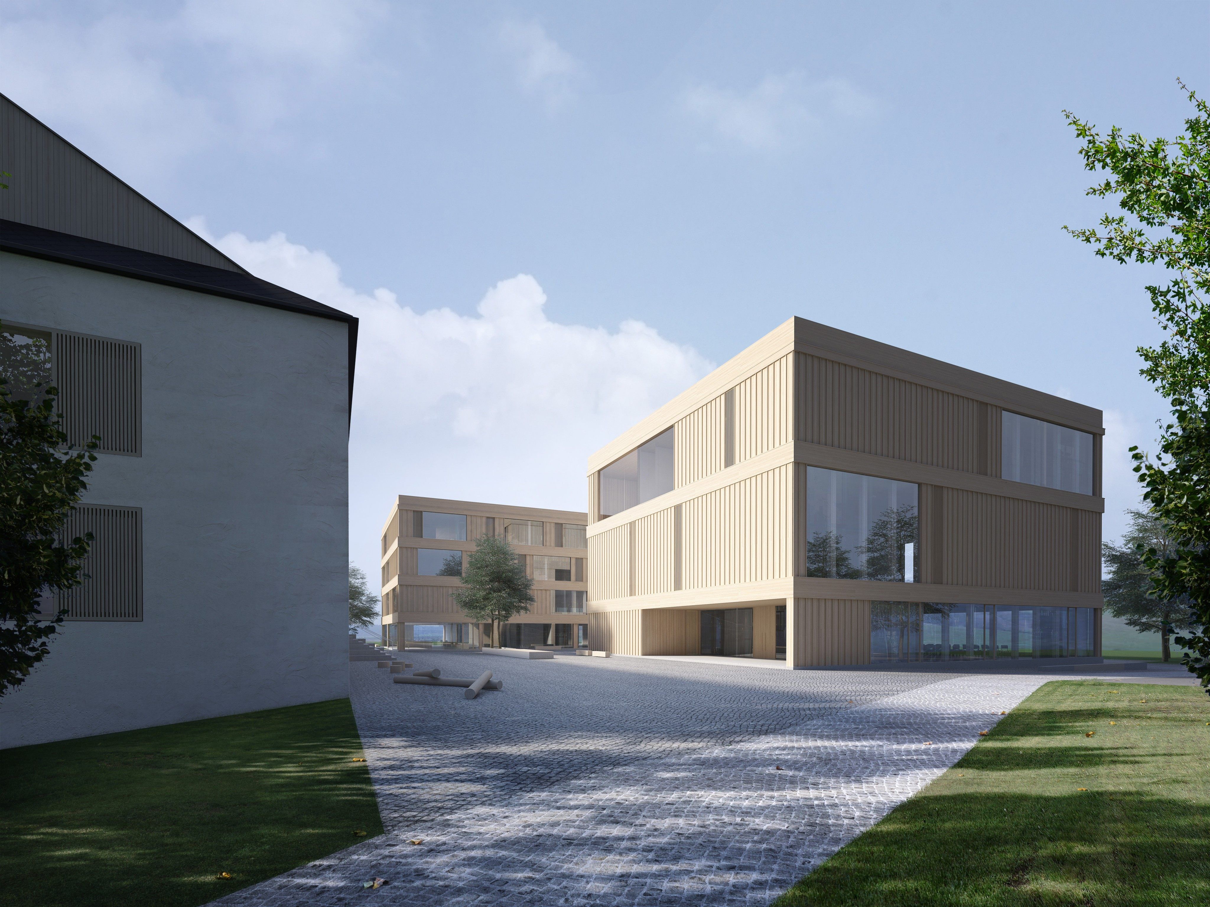 Der Hartl-Bau (jetzige Mittelschule) wird saniert und durch zwei neue Häuser ergänzt.